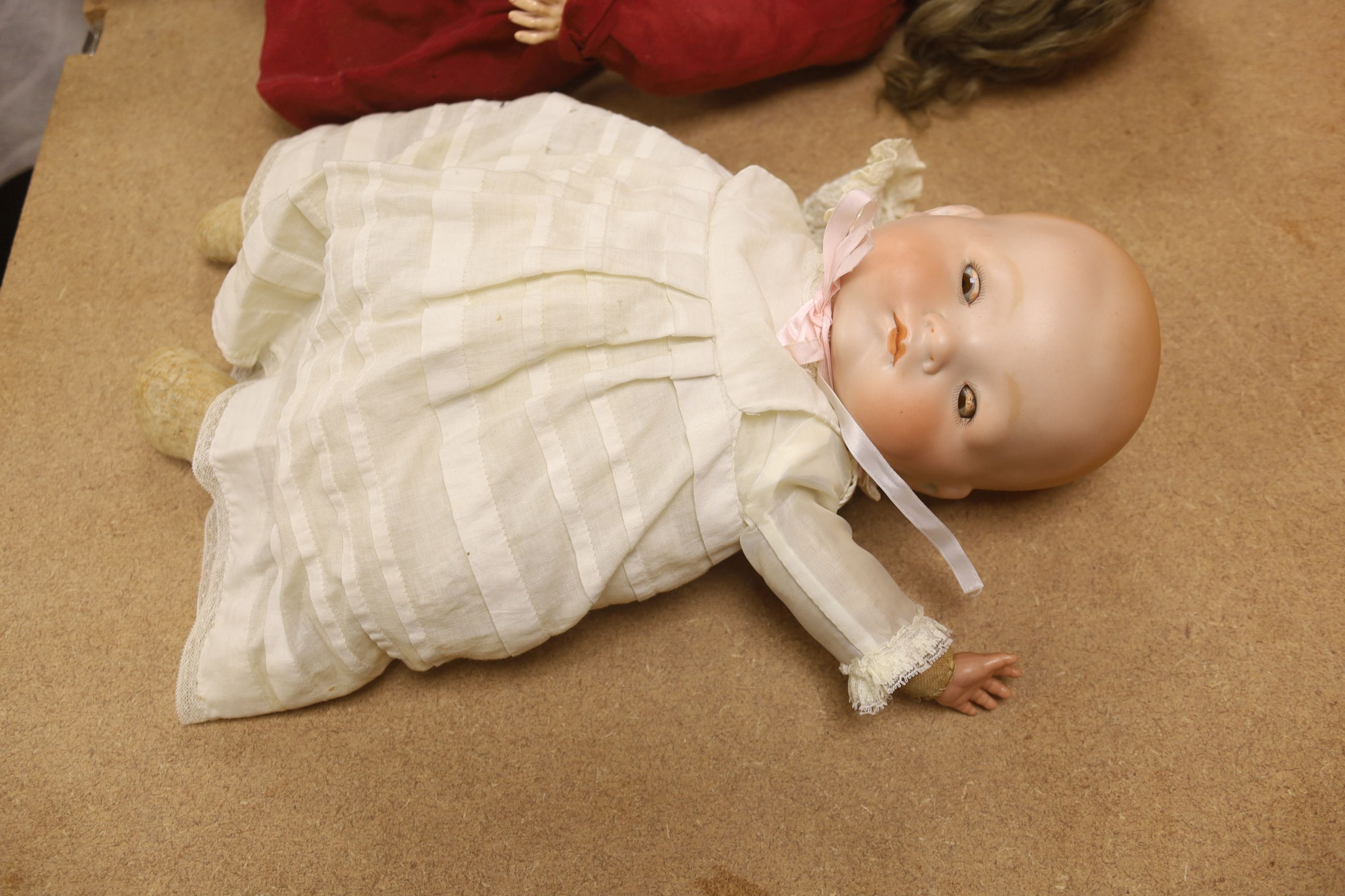 Armand Marseille bisque doll, 390 A5M, with sleeping eyes and open mouth and a similar baby doll